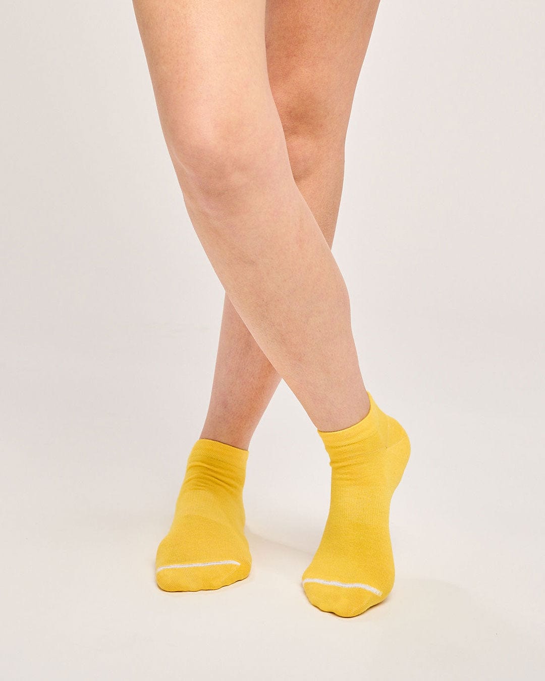 Sustainable yellow trainer socks. Ecofriendly fun running socks