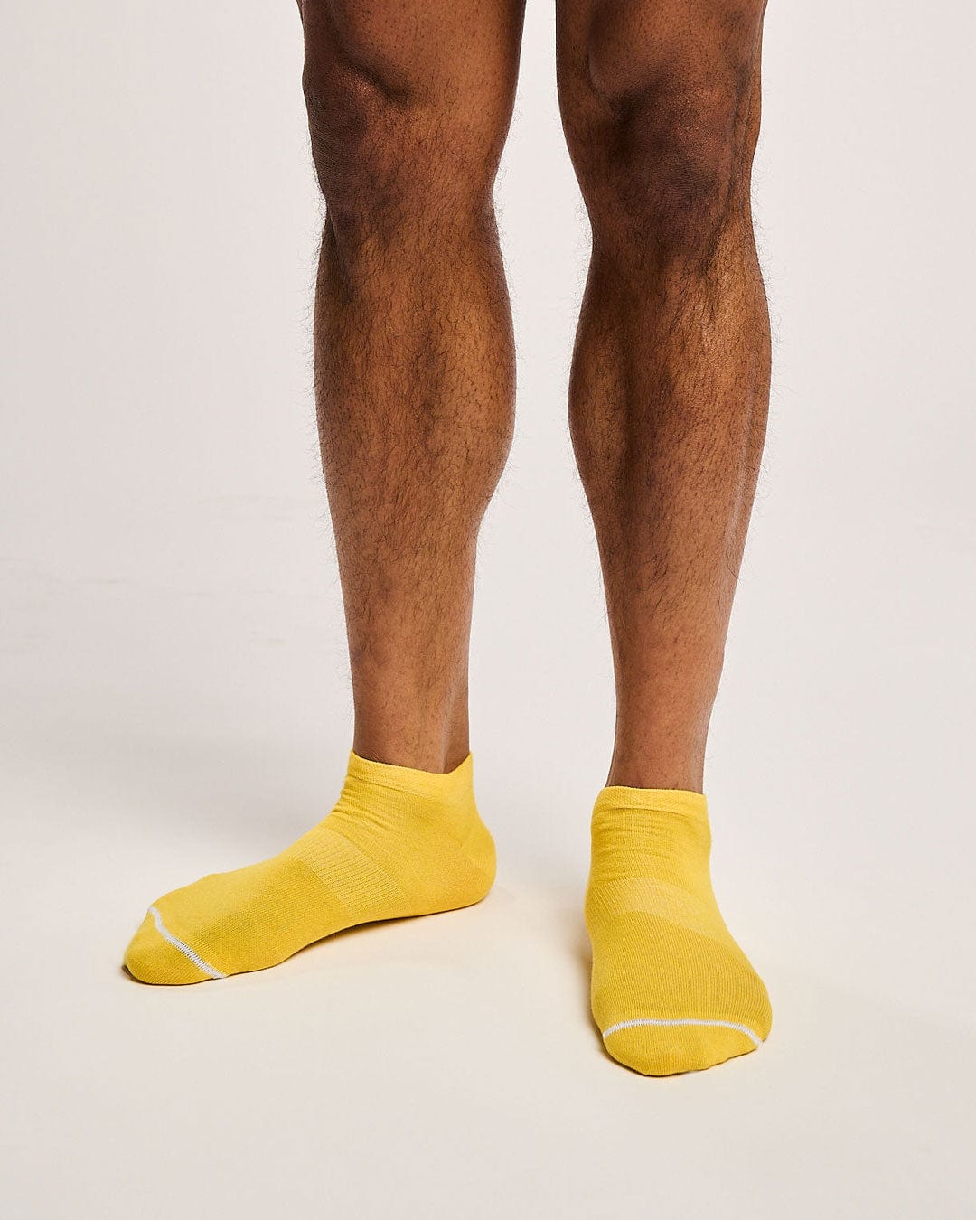 Sustainable yellow sport socks. Mens running socks