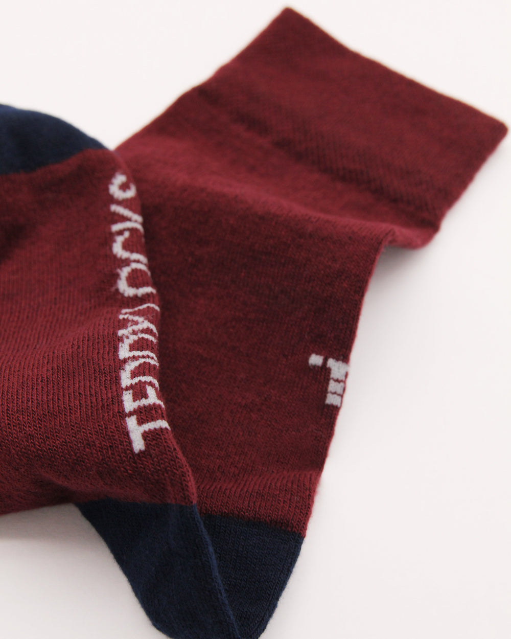 Detailed shot of burgundy and navy everyday crew sock