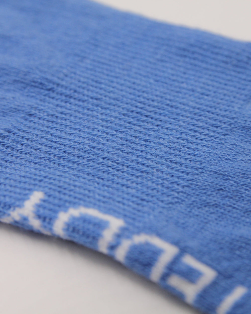 Light blue sock showing arch support elastic