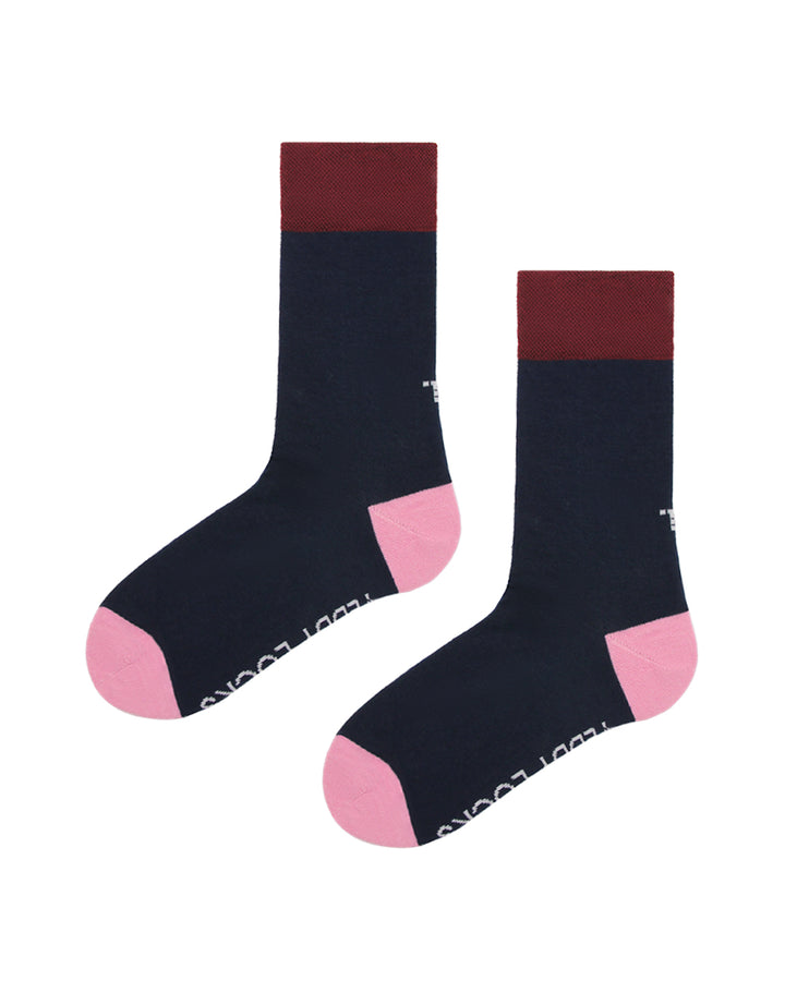 Pair of socks with dark blue body, burgundy top, and pink toes and heels from Teddy Locks