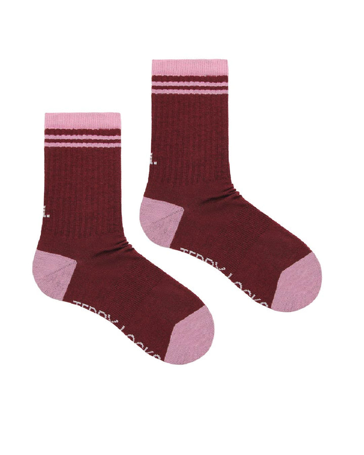 Pair of burgundy ribbed crew socks with pink accents