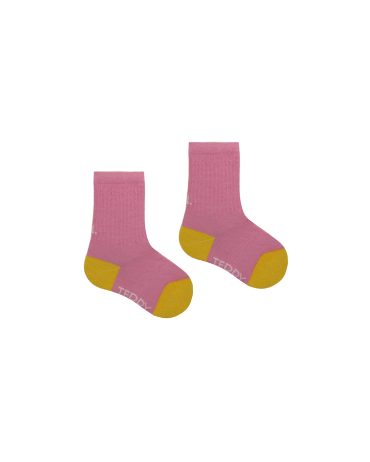 Kids ribbed crew socks in pink with yellow heel and toe