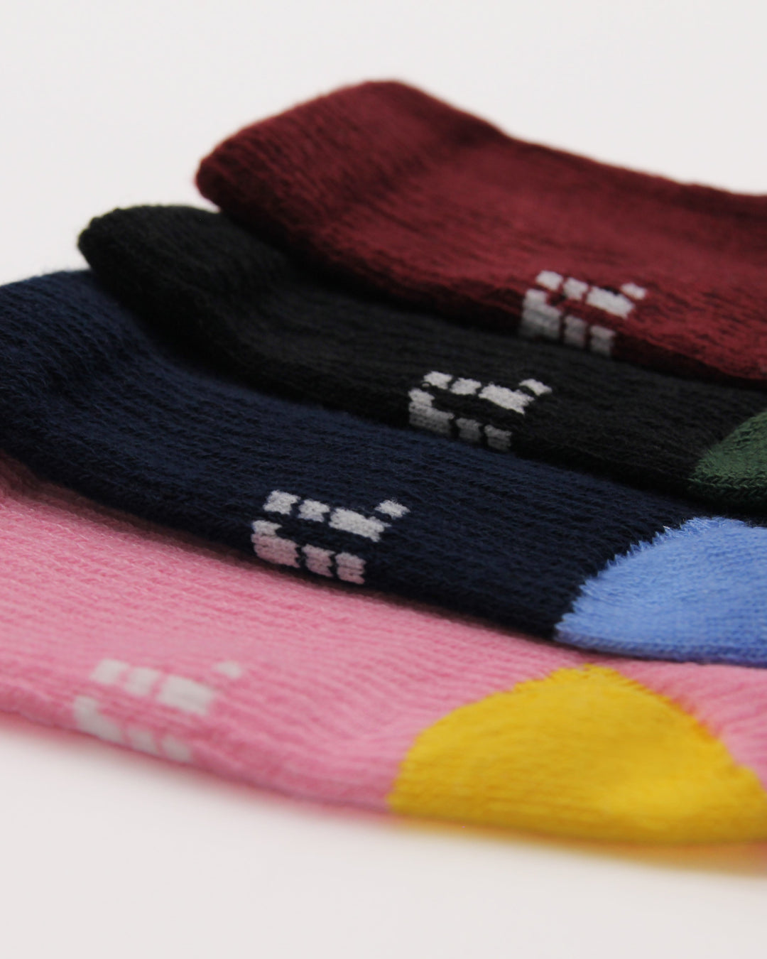 Multi colour pack of baby socks aged 3-12 months
