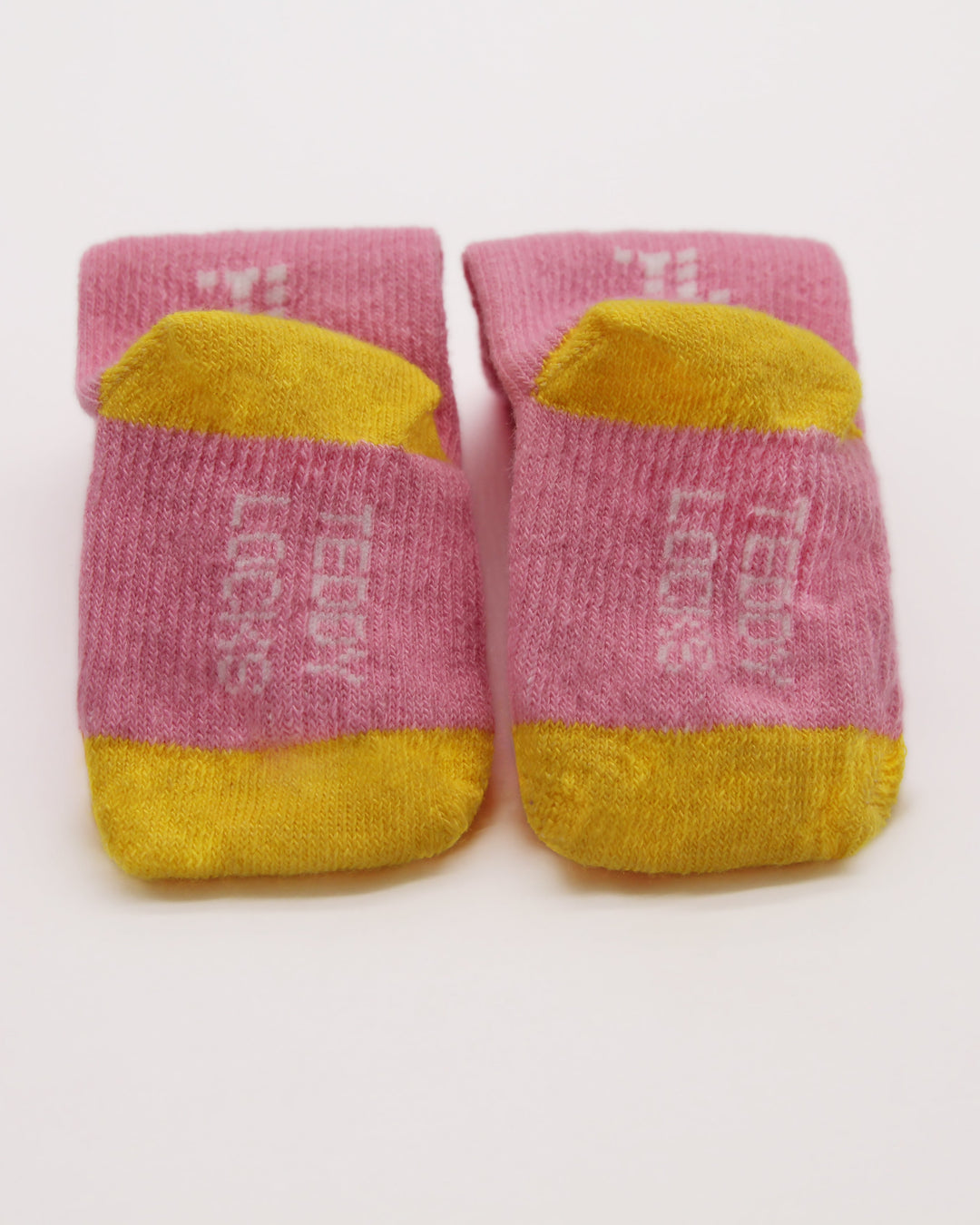 Baby socks in pink and yellow from Teddy Locks