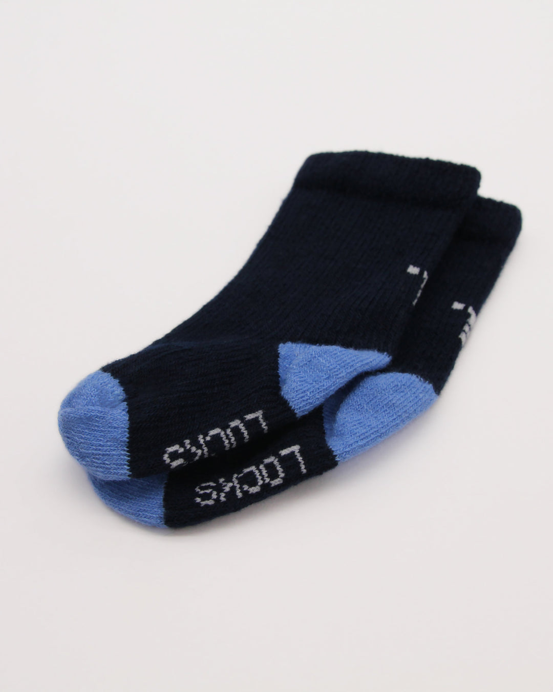 Knitting details of navy and blue baby socks from Teddy Locks