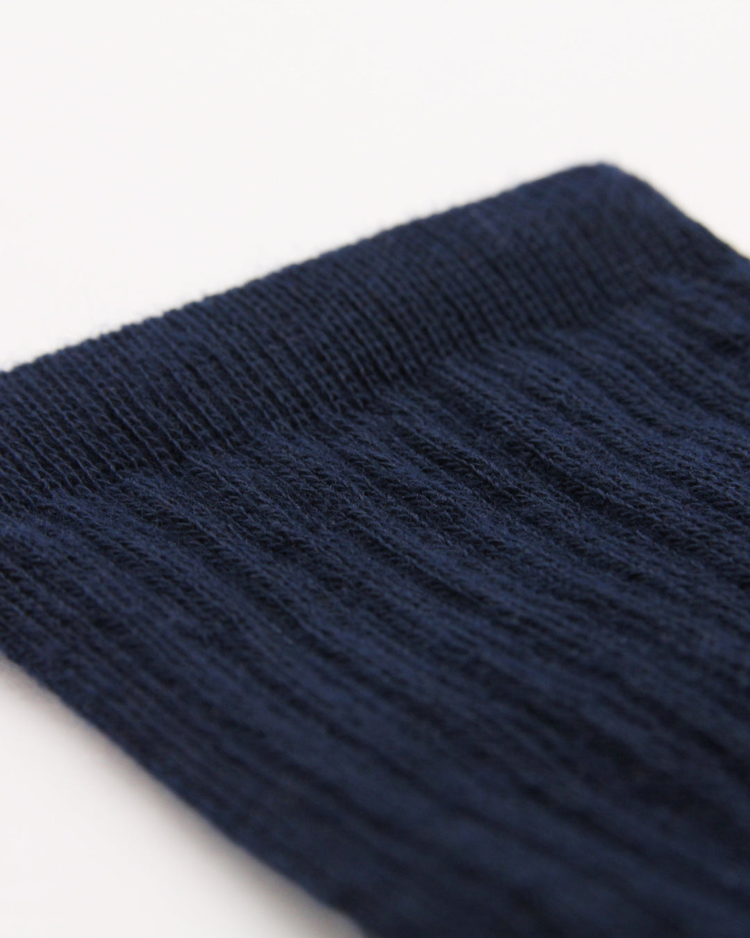 Kids navy blue ribbed crew sock showing elasticated leg