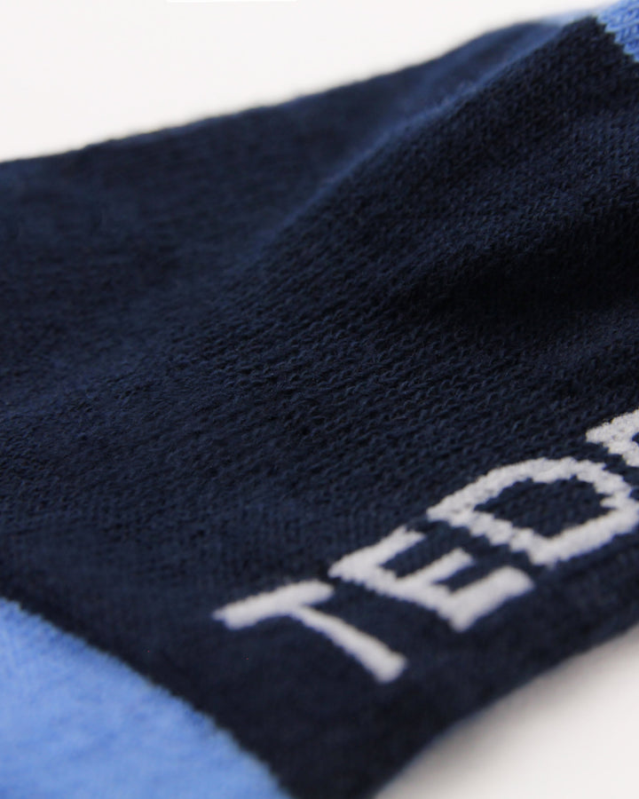 Navy blue ribbed crew socks with arch support and blue heel and toe