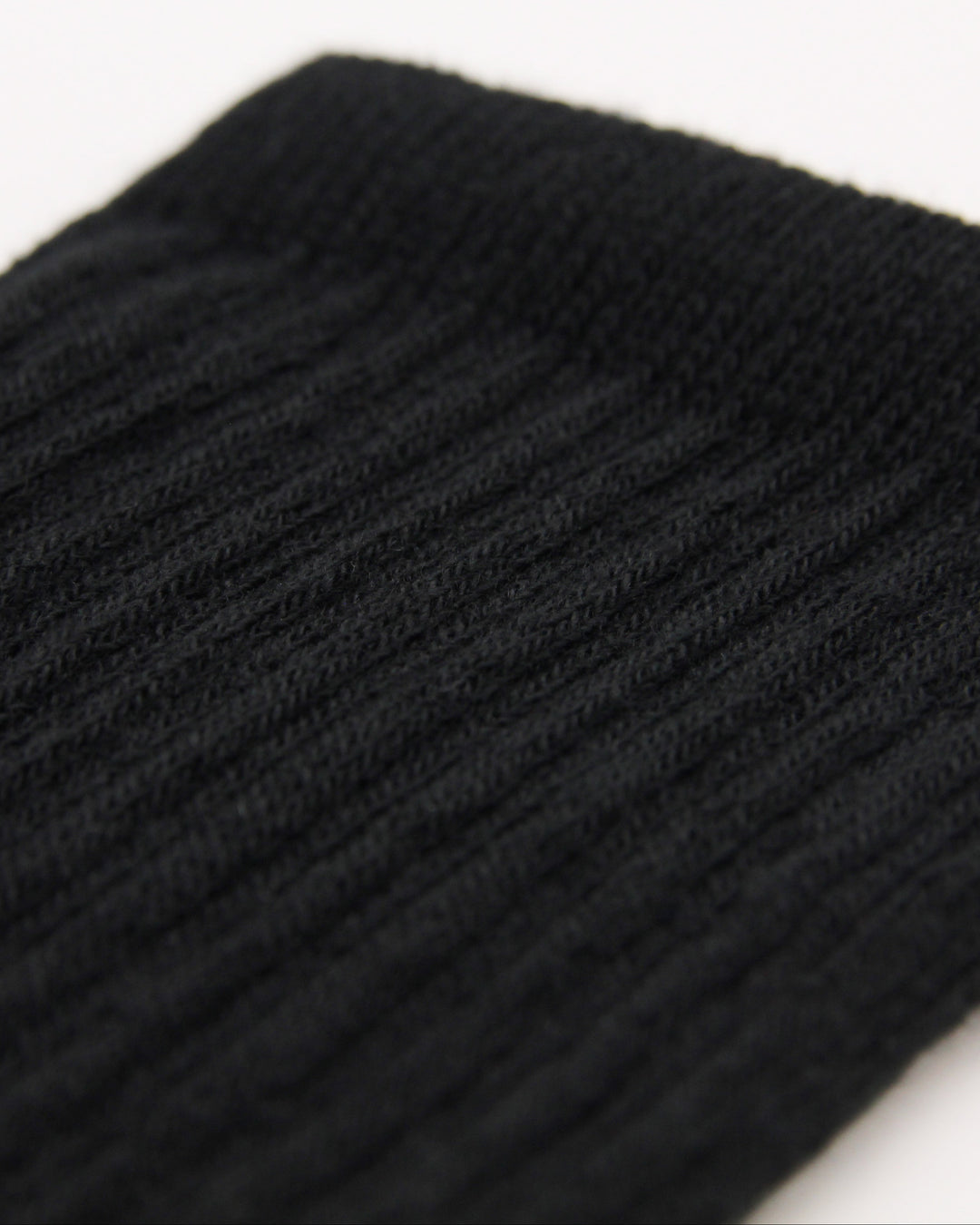 Close-up of black ribbed crew sock detailing for kids