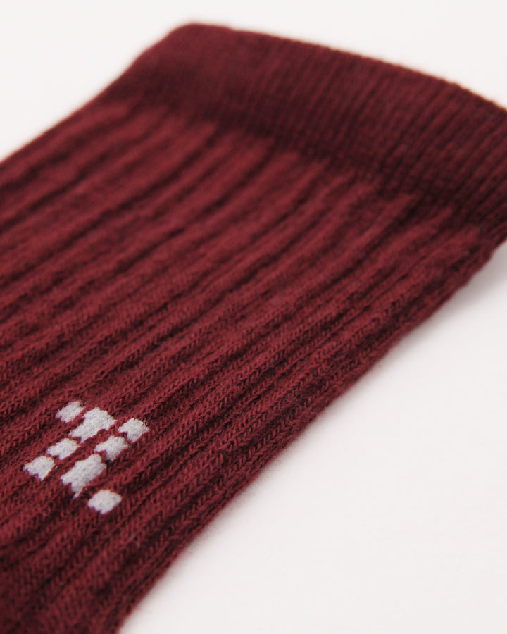 Close-up of burgundy ribbed crew sock for children