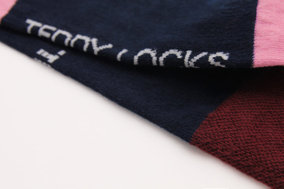 Close-up of our navy, pink and burgundy crew sock with Teddy Locks branding.