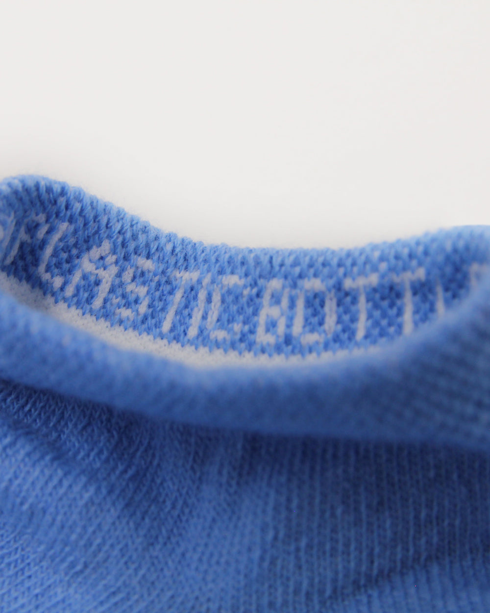 Blue trainer socks made from recycled plastic bottles.