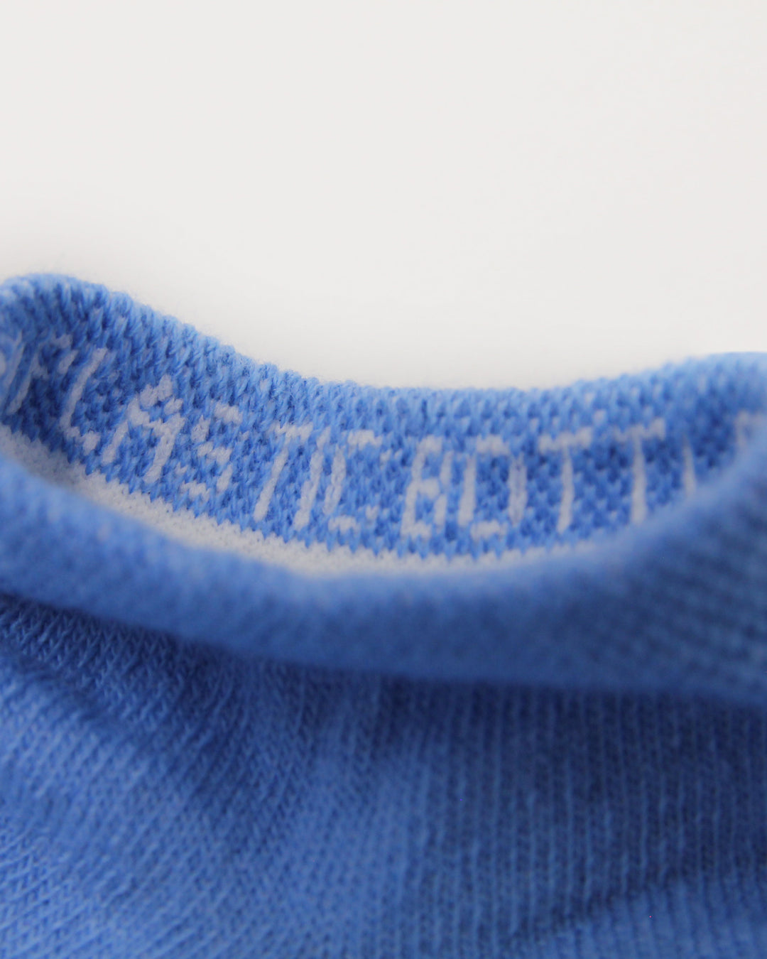 Blue trainer socks made from recycled plastic bottles.