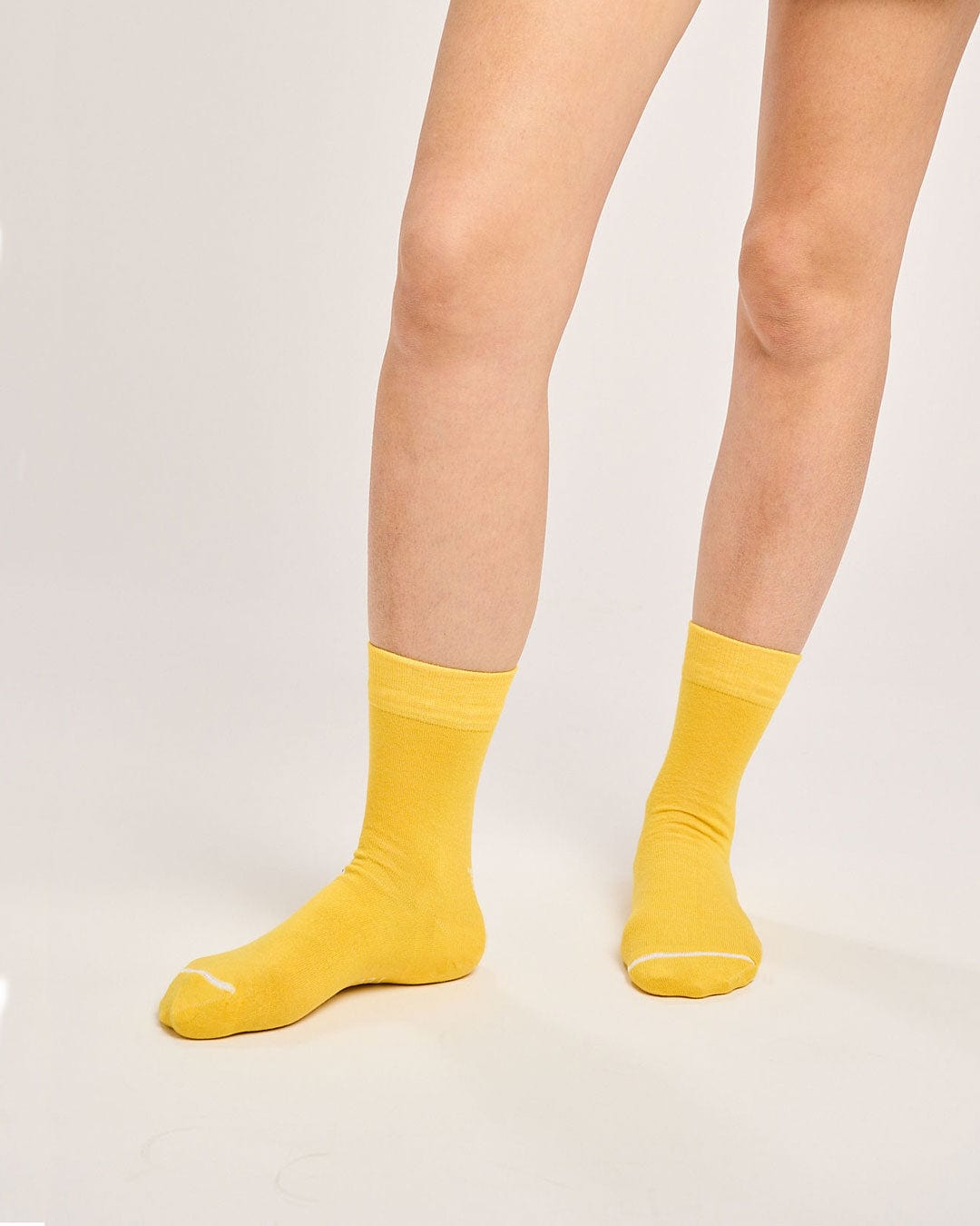 Ecofriendly yellow socks for women. Sustainable seamless toe socks