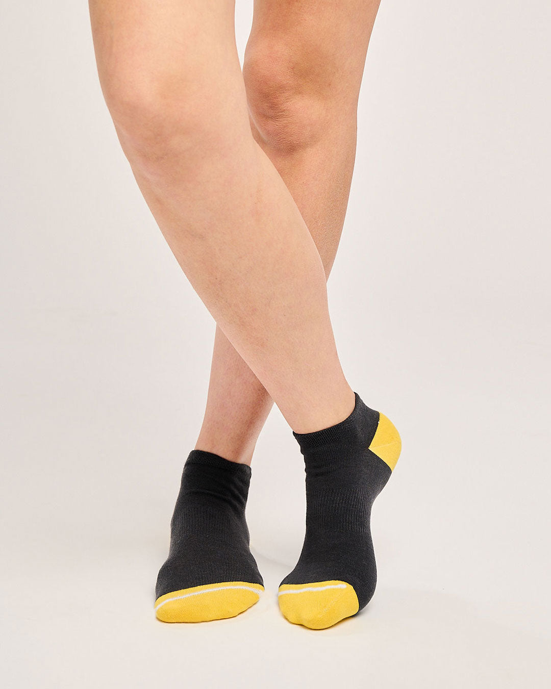 Sustainable black trainer socks. Eco-friendly running socks. Seamless toe socks