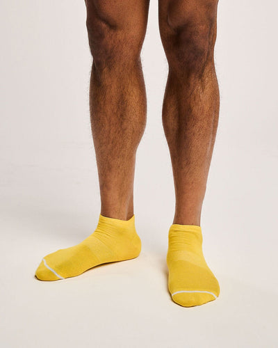 Sustainable yellow sport socks. Mens running socks