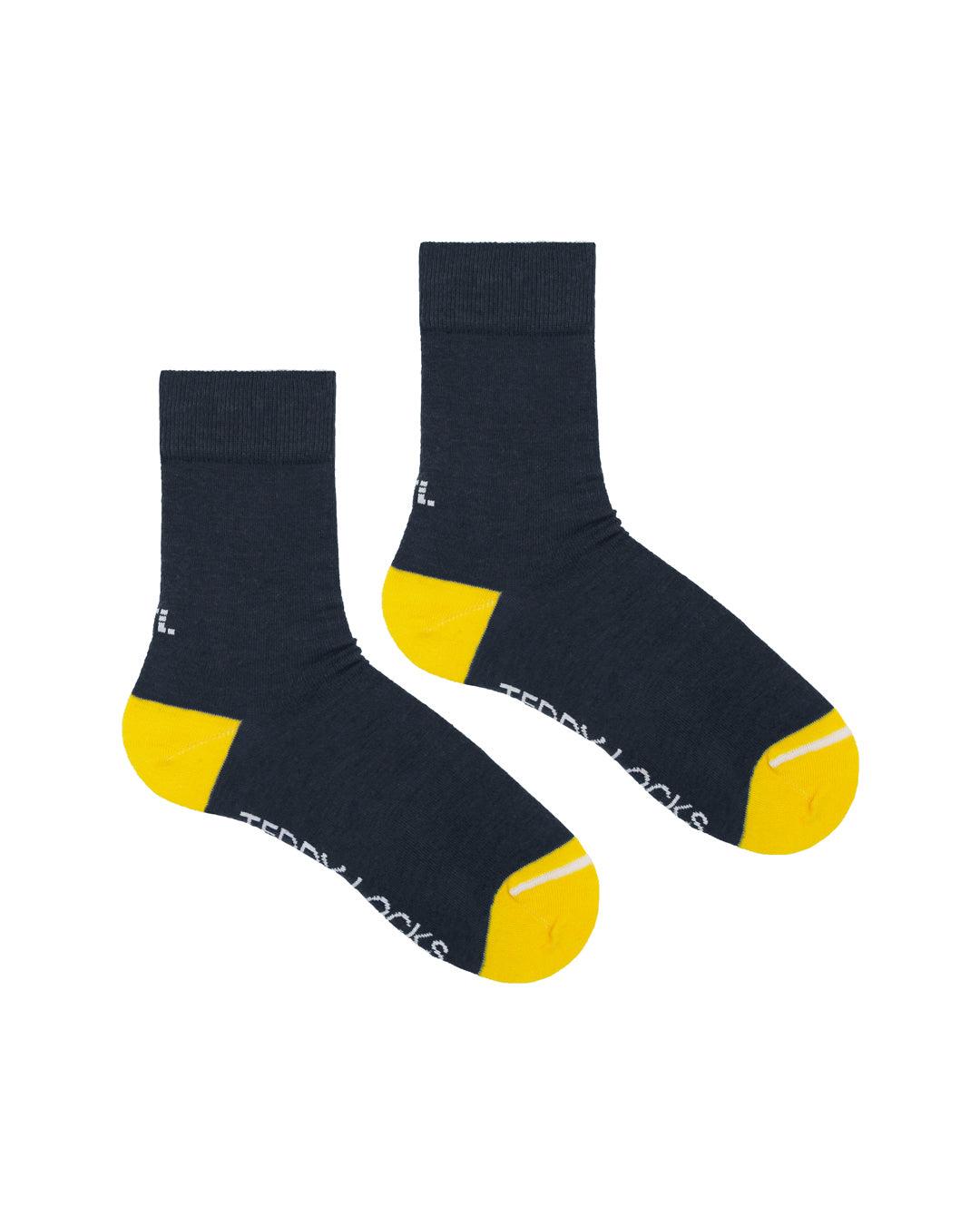 Ecofriendly socks made in the USA. Black socks with gold toes.