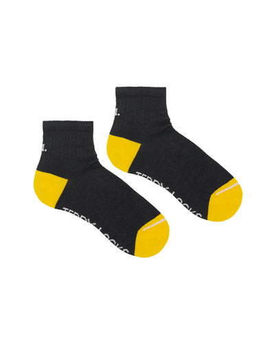 Ecofriendly black quarter length socks made from recycled plastic bottles. Seamless toe socks